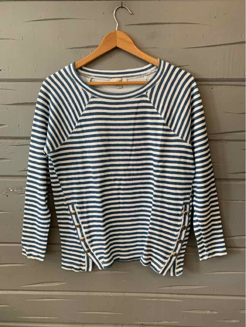 Blue and white striped long-sleeve crew neck shirt with side slits on a wooden hanger.