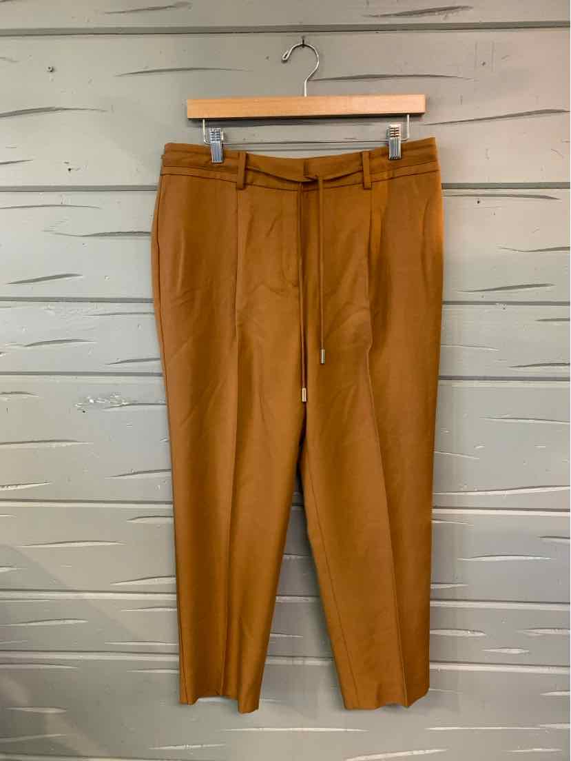 Camel brown high-waist tapered pants with belt loops and tailored pleats.