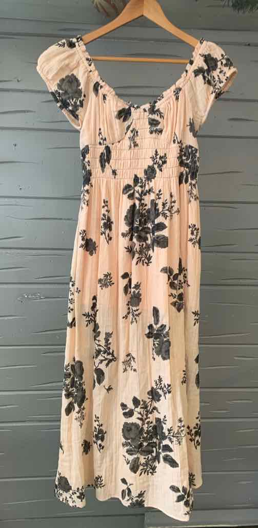 Peach maxi dress with black floral print, puffed short sleeves, and fitted bodice in size XS.