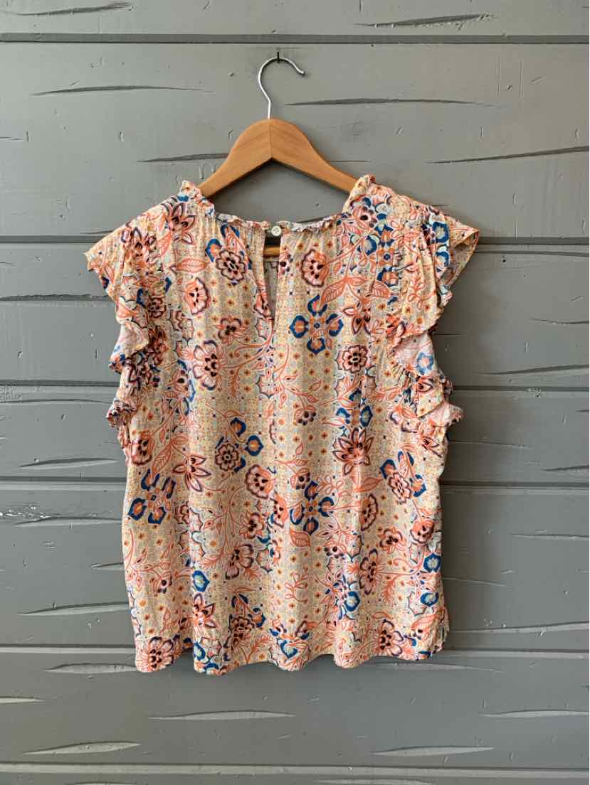 Peach short-sleeve blouse with blue and orange floral print, ruffled sleeves, and keyhole neckline.