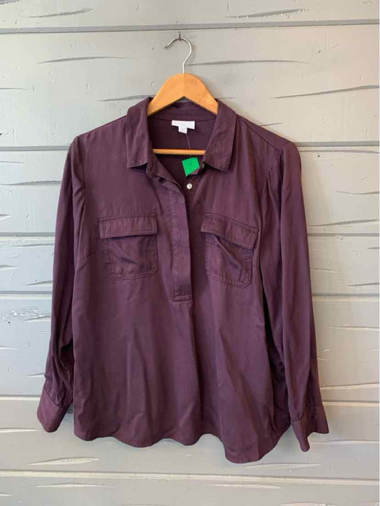 Long-sleeve plum-colored button-up blouse with two chest pockets and a soft fabric finish.