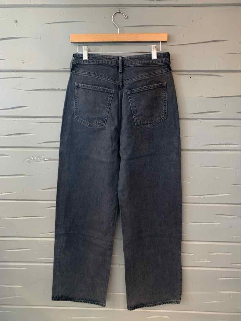 Dark charcoal Old Navy denim jeans with a straight-leg cut, front pockets, and belt loops, hanging from a wooden hanger.