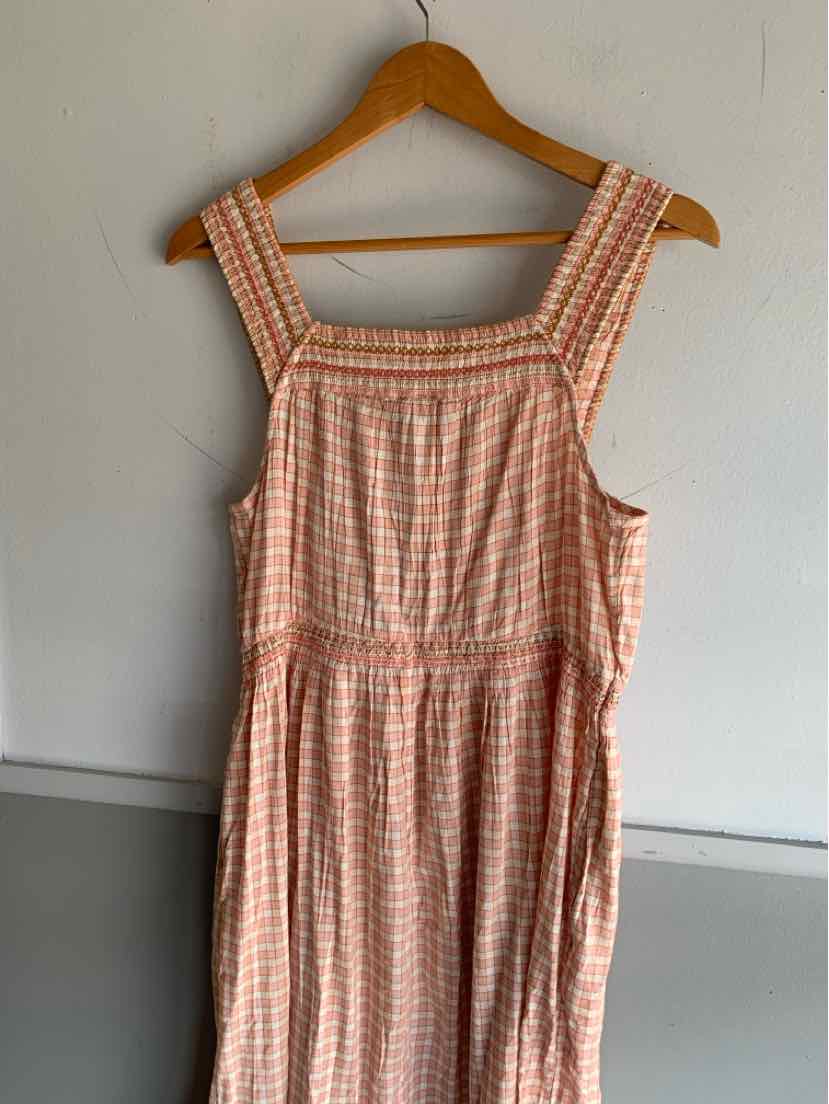 Pink and white gingham sleeveless dress with square neckline and gathered waist.