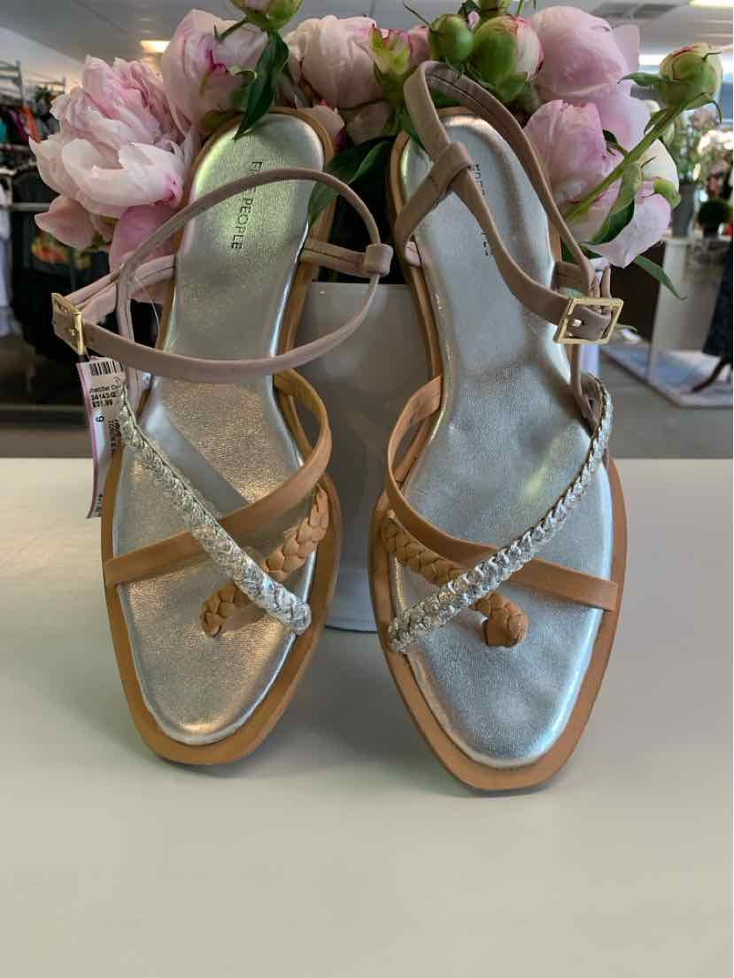 Metallic silver and tan leather strappy flat sandals with ankle buckle and square toe.