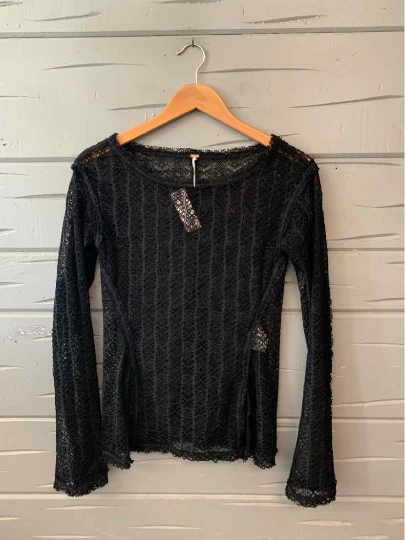 Black long-sleeve lace top with scalloped edges, sheer details, and a fitted silhouette.