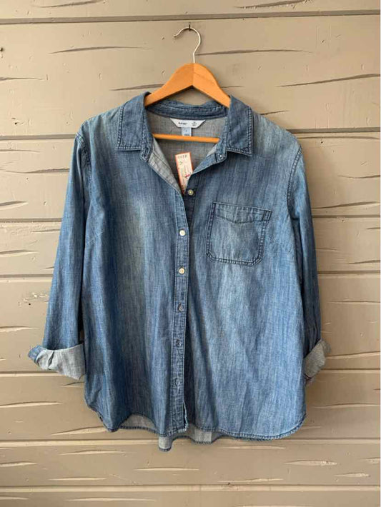Light blue denim button-up shirt with long sleeves and chest pocket, rolled cuffs, size XL.
