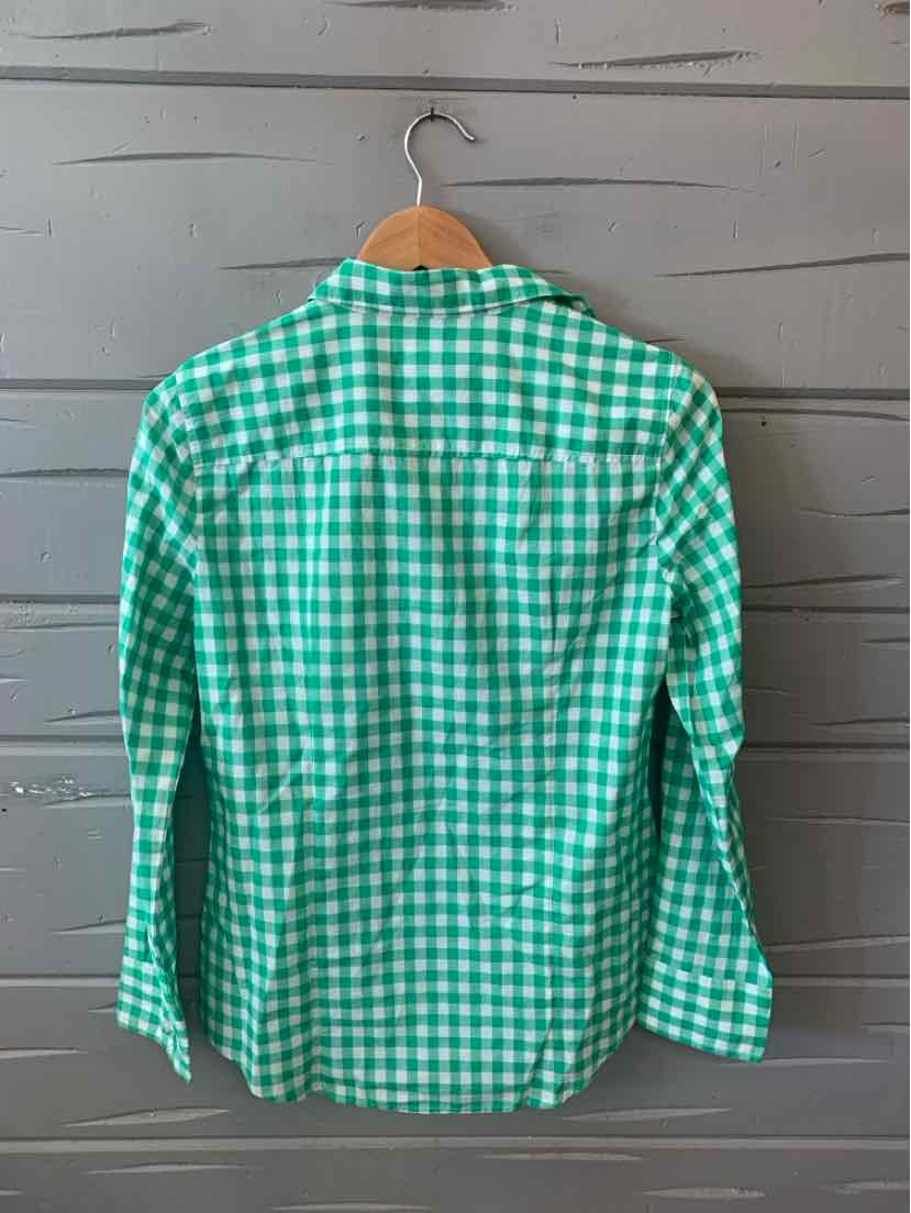 Green and white gingham long-sleeve button-up shirt on wooden hanger.