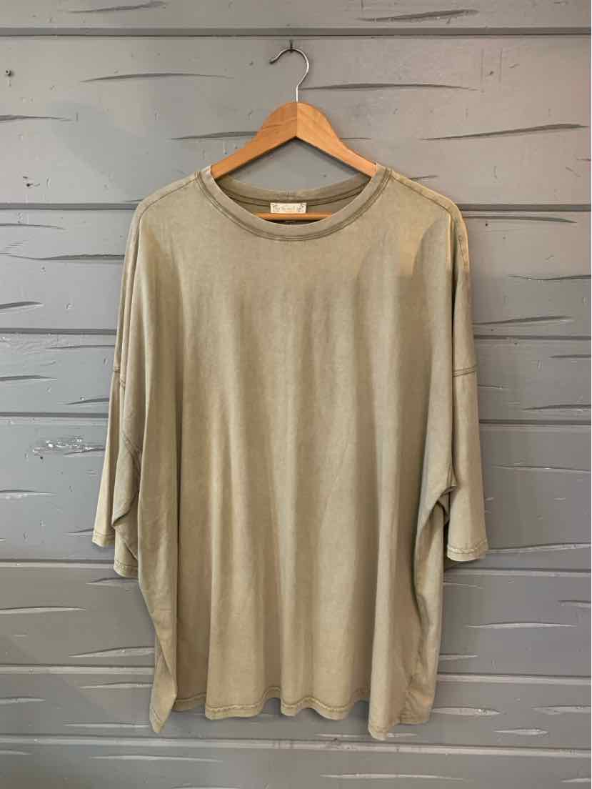 Beige loose-fit tunic top with a rounded neckline and three-quarter sleeves.