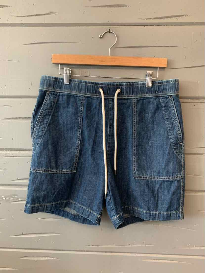Denim blue casual shorts with front patch pockets and white drawstring waistband.