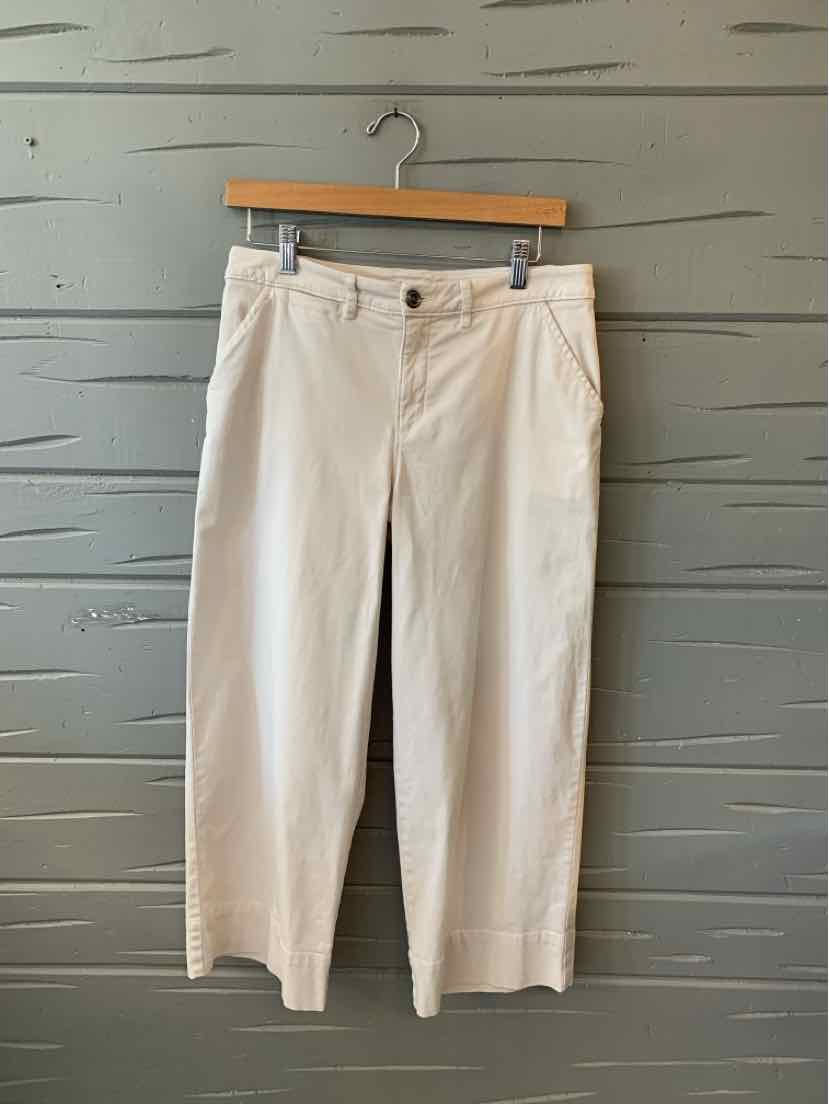 Light beige straight-leg pants with button and zipper closure, front pockets, and belt loops.