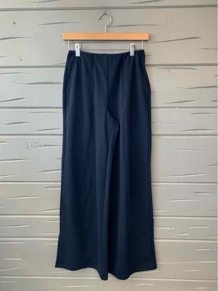 Navy blue Old Navy wide-leg trousers with a smooth finish, hanging from a wooden clip hanger.