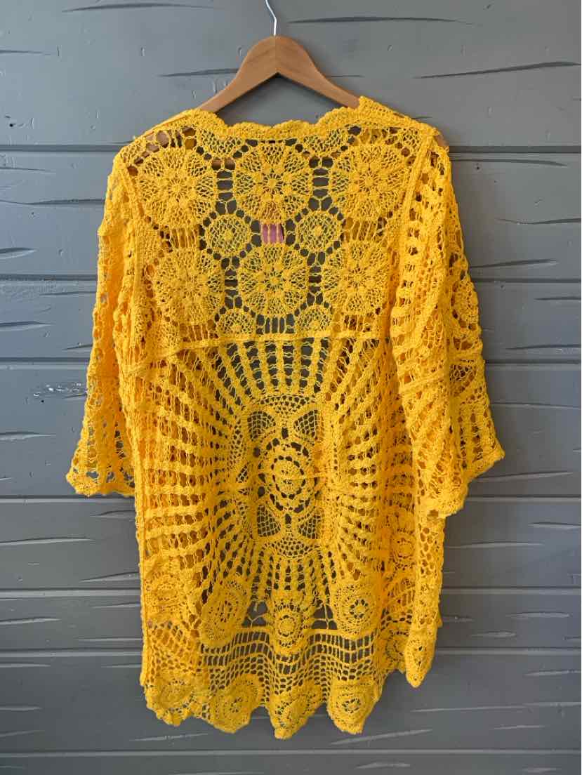 Yellow crochet knit cardigan with intricate floral and geometric lace patterns, mid-length sleeves, and scalloped hem.