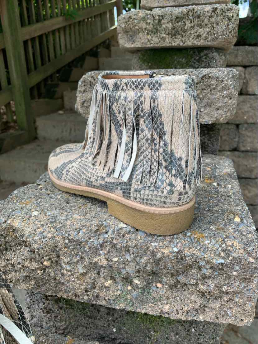 Tan snake print ankle boot with fringe detail and low stacked heel.