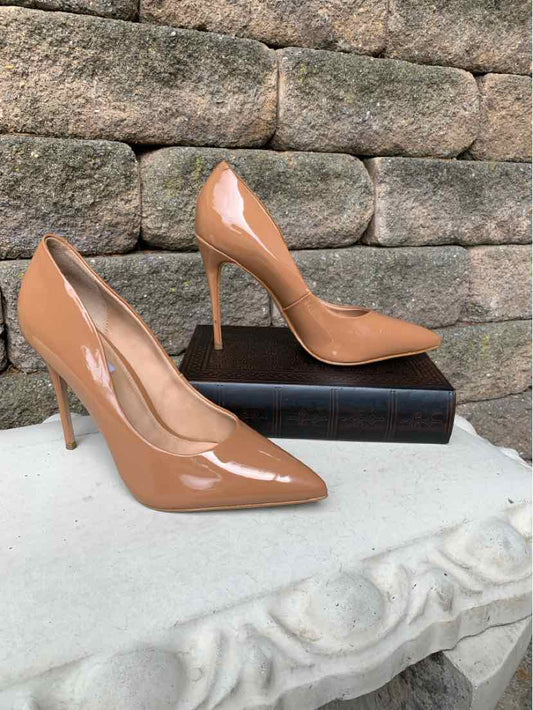 Tan patent leather pointed-toe stiletto pumps with slim high heels, size 9.