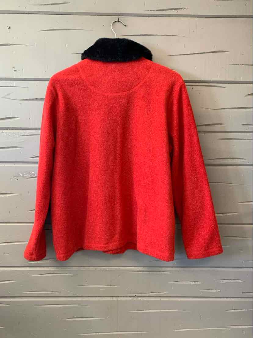 Red fleece pullover with long sleeves and a black collar, shown from the back.