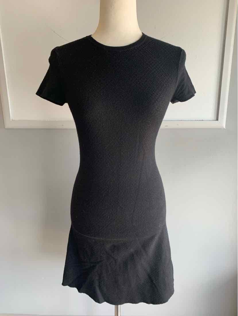 Black short-sleeve fitted dress with round neckline and subtle ruffle hem, size small.