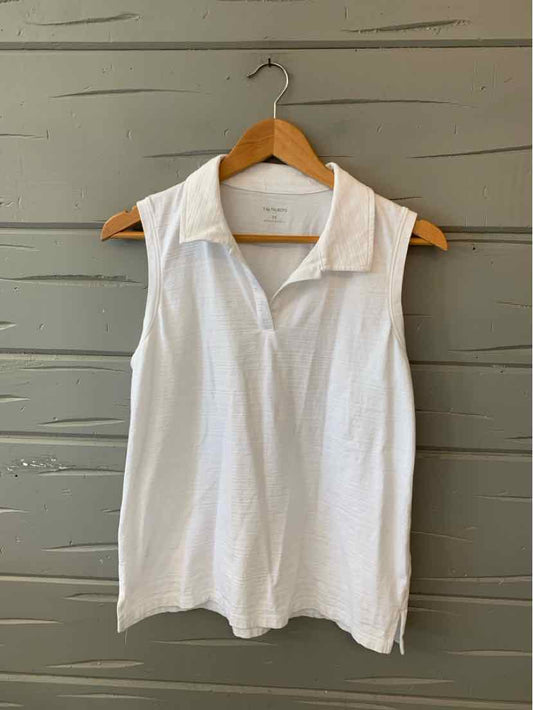 White sleeveless collared blouse with a V-neck and a relaxed fit on a wooden hanger.