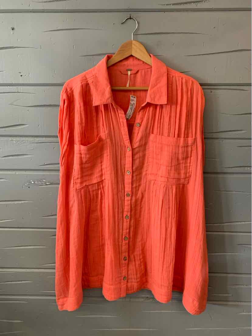 Coral button-up blouse with long sleeves, chest pockets, and vertical pleats.