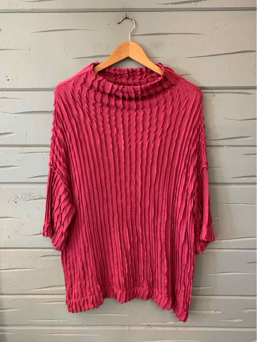 Bright fuchsia crinkle tunic with a draped cowl neck, loose sleeves, and an asymmetrical hem.
