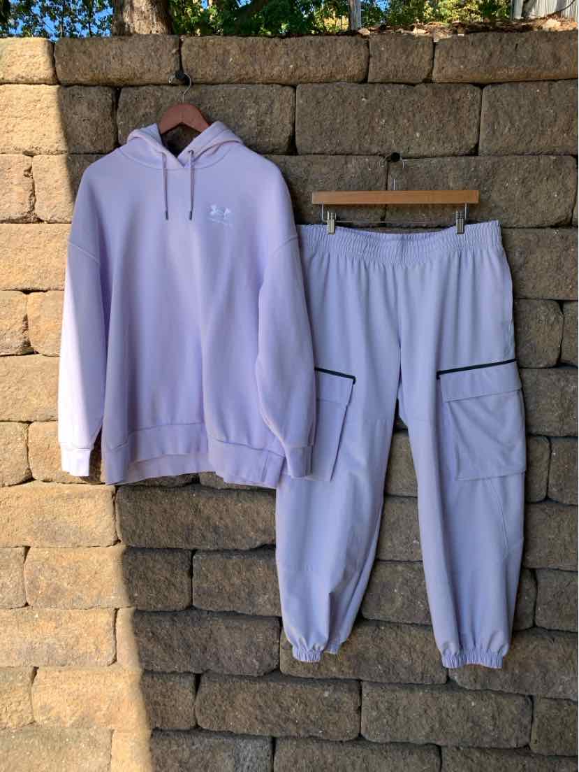 Light lavender Under Armour two-piece set with a hooded sweatshirt and matching joggers.
