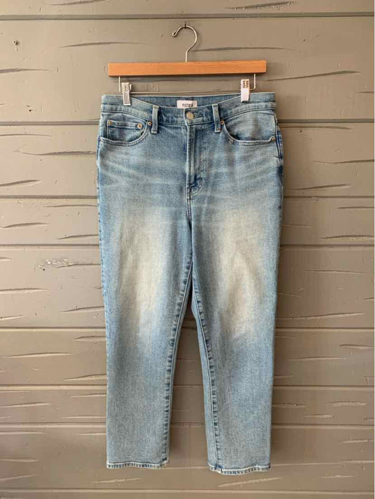 Light blue denim jeans with a high waist and tapered legs, faded front details, and classic five-pocket design.