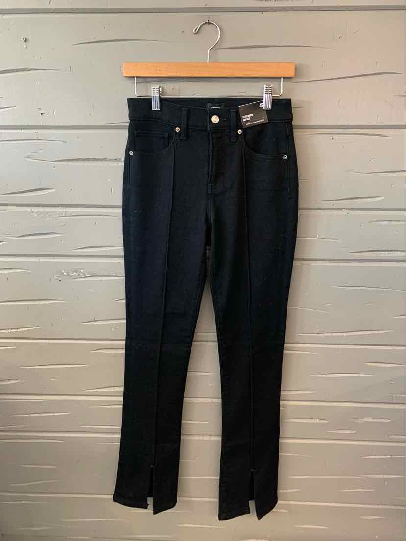 Black high-waist skinny jeans with front zipper and button closure, size 4.