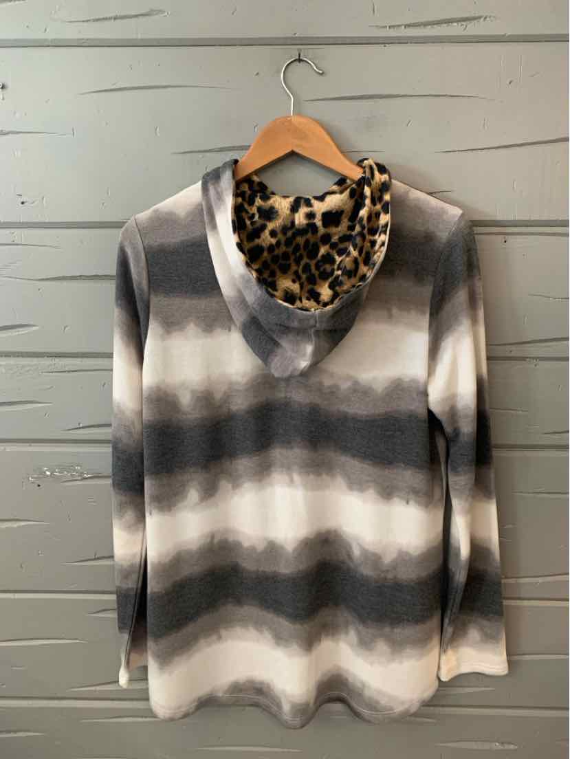 Long-sleeve V-neck tie-dyed shirt in shades of gray and white with a soft leopard print scarf draped inside the neckline.