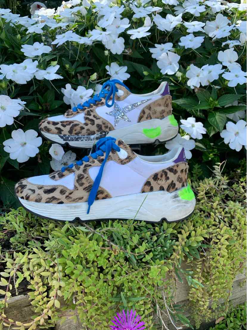 White and leopard print sneakers with blue laces, star detail, and neon green accents, size 37.