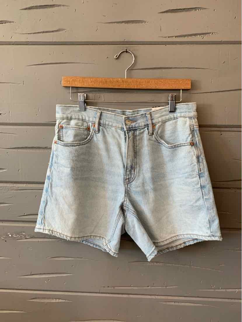 Light blue denim shorts with classic five-pocket styling and a button fly, size 6.