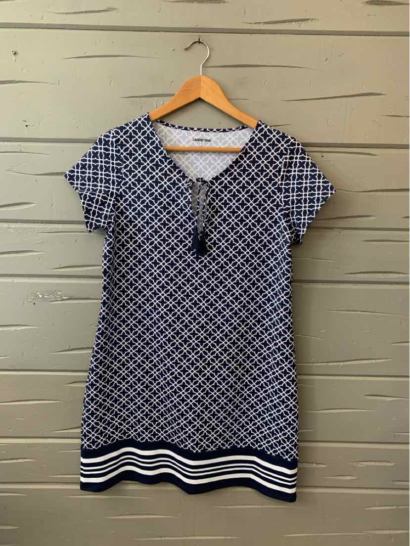 Navy and white geometric print short-sleeve dress with V-neck and striped hem.
