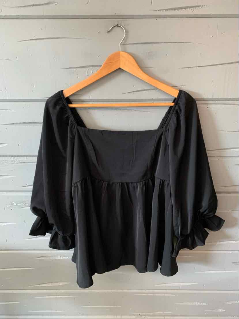 Black square-neck blouse with puffed 3/4 sleeves and ruffled cuffs, loose fit.