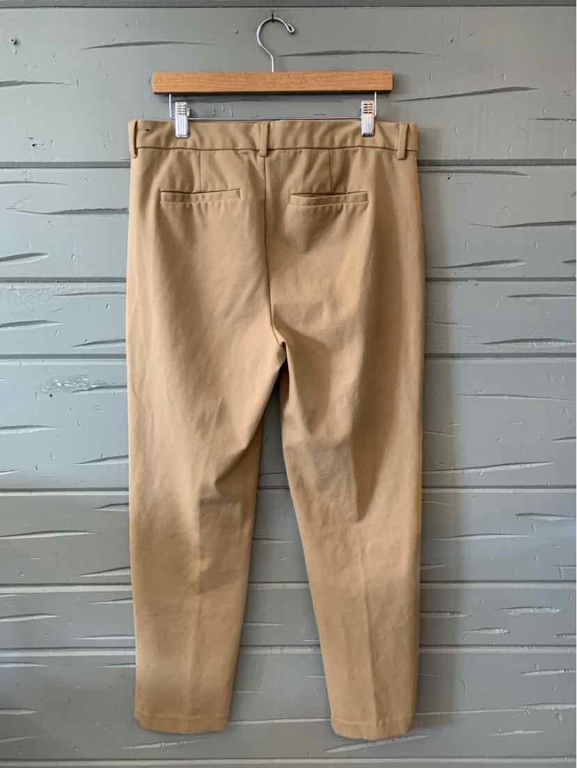 Tan solid cotton blend pants with elastic waistband and back welt pockets, size 14.