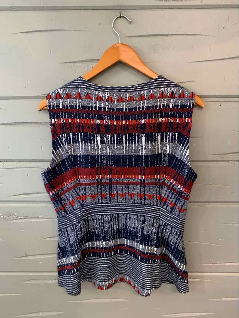 Sleeveless blouse with horizontal geometric pattern in navy, red, white, and black on lightweight fabric.