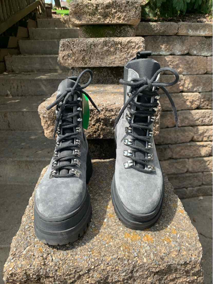 Gray suede lace-up ankle boots with chunky black soles and padded collars, size 5.5.