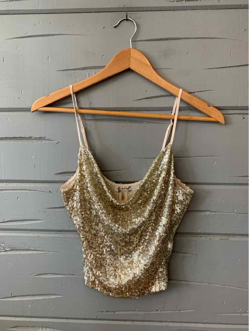 Gold sequin cropped camisole with thin adjustable spaghetti straps and a draped neckline.
