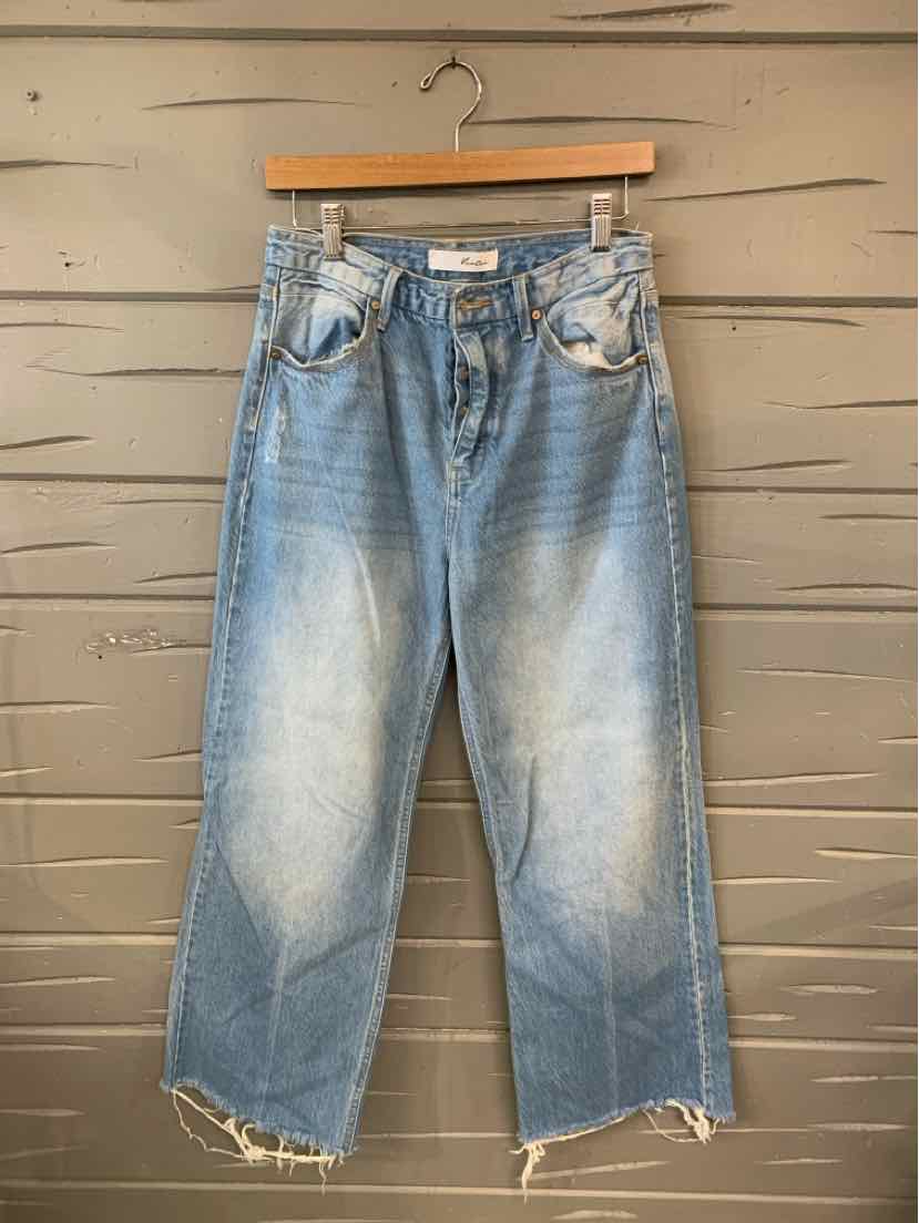 Light blue faded denim jeans with frayed hems and front pockets, size 7.