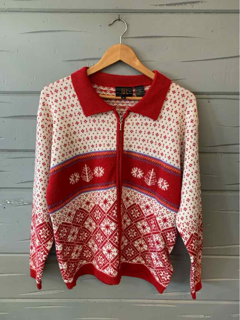Red and white patterned knit sweater with zipper and red collar, size medium.