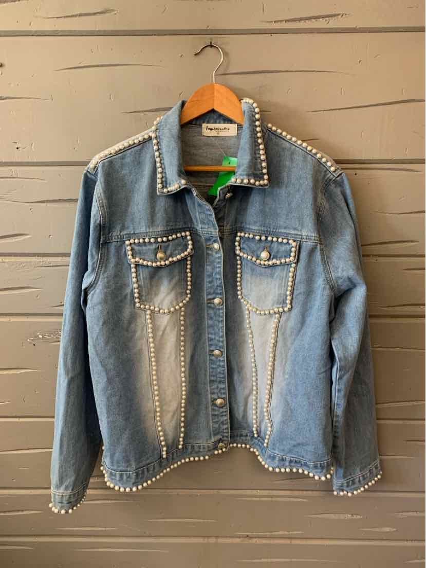 Light blue denim jacket with white stitch detailing along seams, collar, pockets, and cuffs, featuring two front flap.