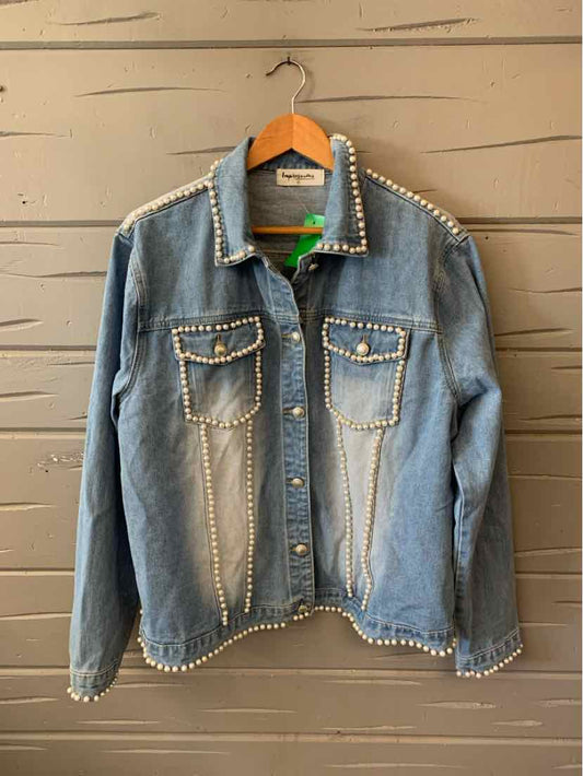 Light blue denim jacket with white stitch detailing along seams, collar, pockets, and cuffs, featuring two front flap.