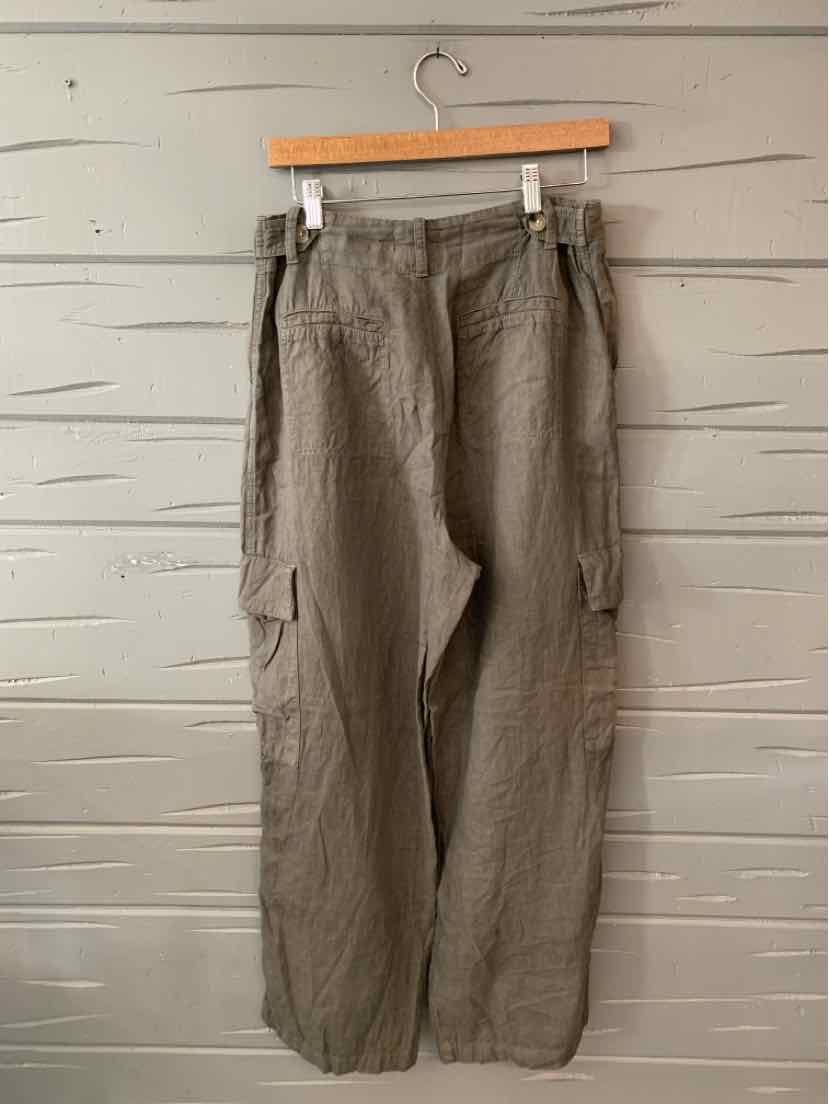 Gray linen cargo pants with multiple pockets and a relaxed fit hanging on a wooden hanger.