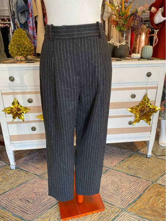 Gray pinstripe high-waist tailored pants with wide belt loops and straight legs, size 8.