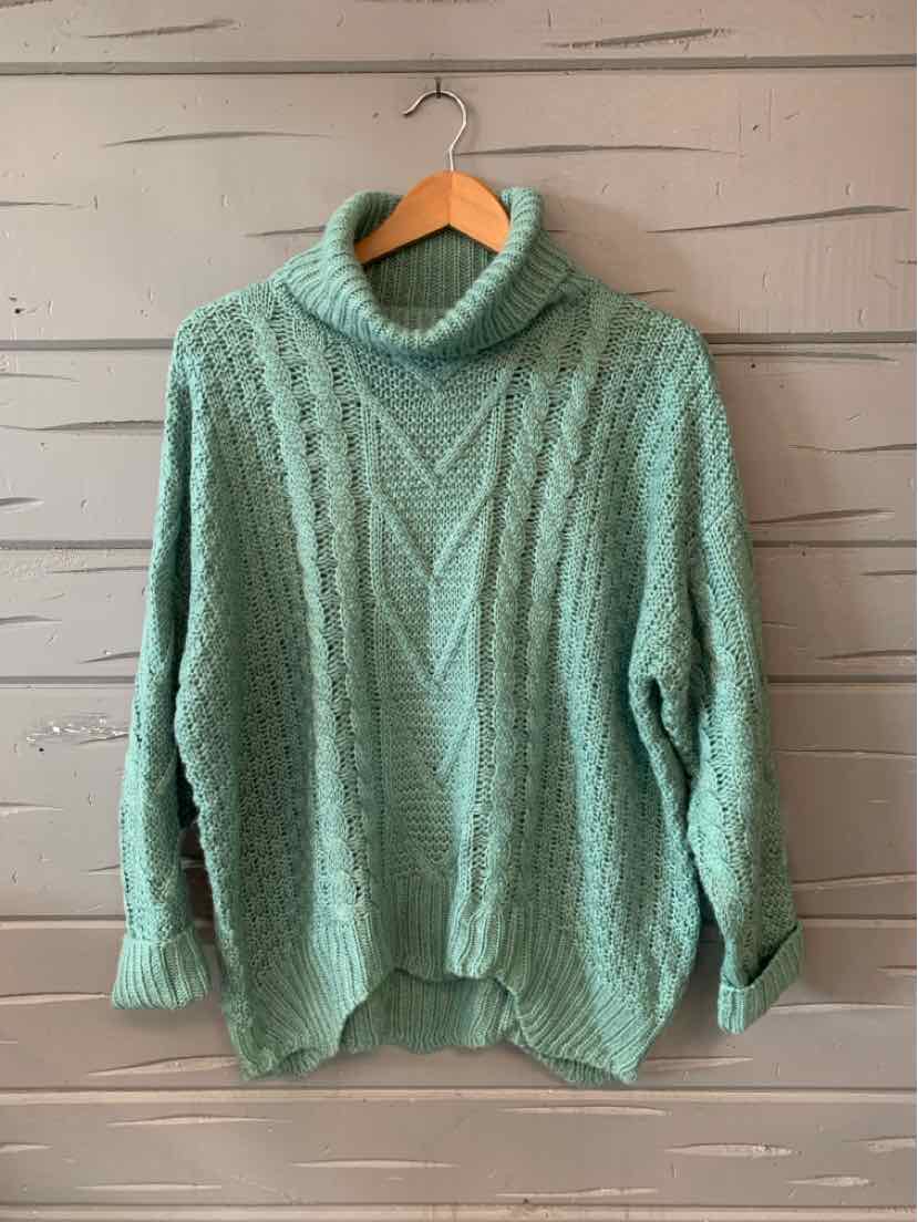 Light green chunky knit turtleneck sweater with cable-knit pattern and ribbed cuffs and hem.