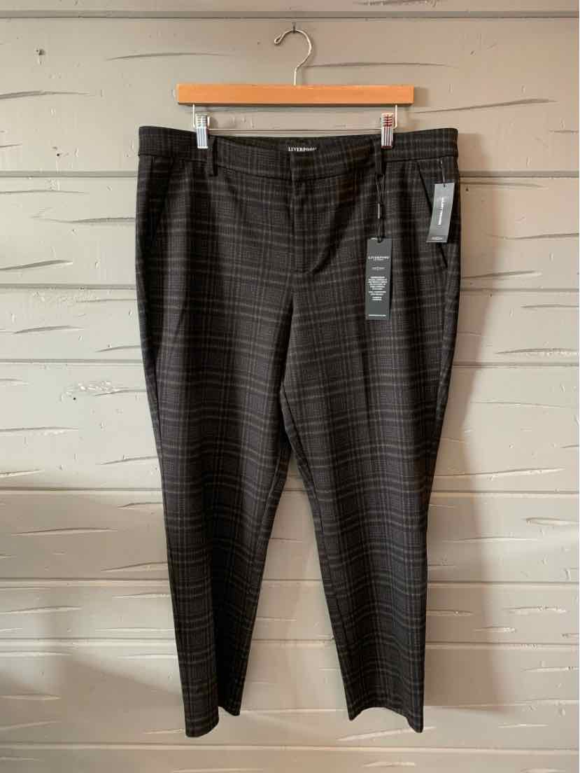Black slim-fit pants with subtle check pattern and front zipper closure, size 14.