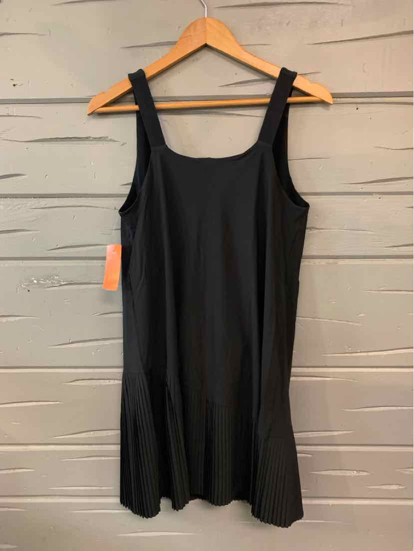 Black sleeveless fitted shapewear slip dress with wide straps hanging on wooden hanger.