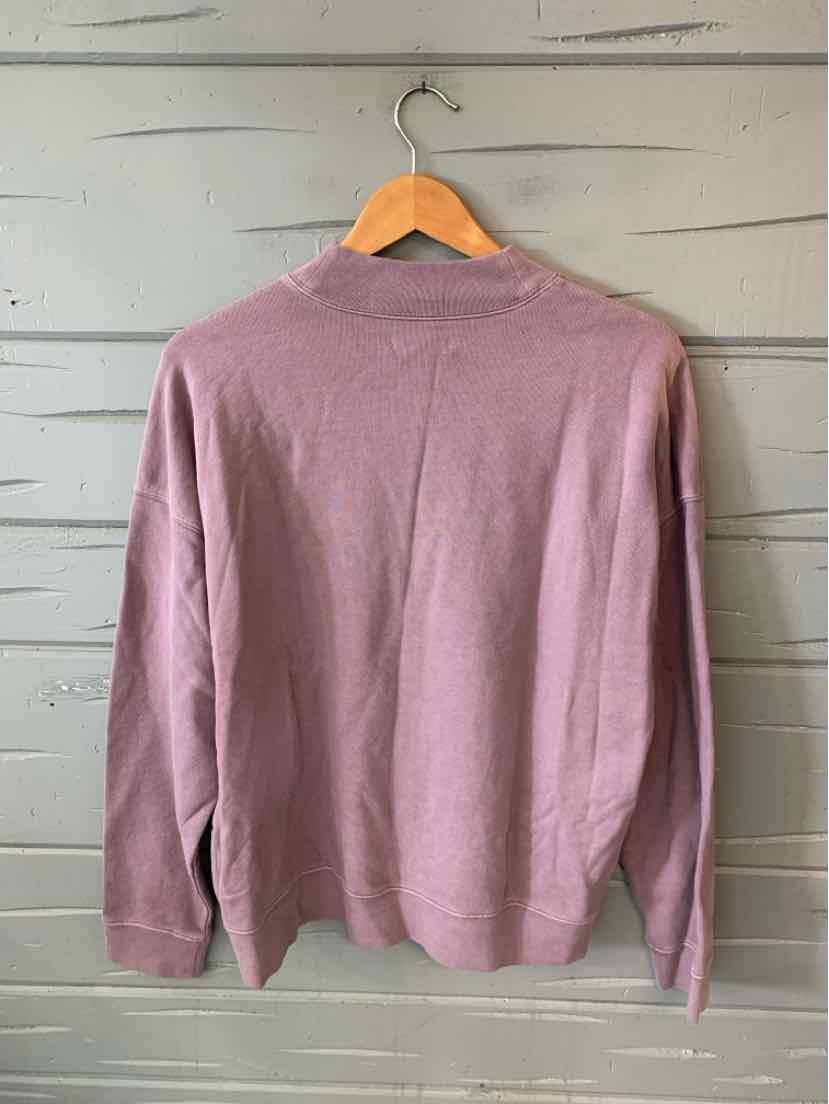 Mauve long-sleeve knit sweater with crew neckline and ribbed cuffs in size large.