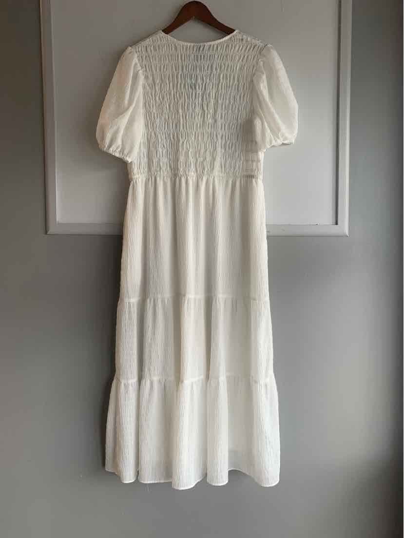 White tiered maxi dress with puff sleeves and smocked bodice, size XL.
