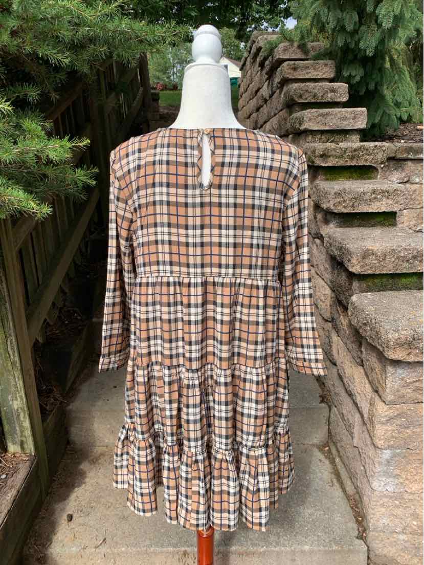 Brown and beige plaid dress with 3/4 sleeves, tiered skirt, and back keyhole detail.