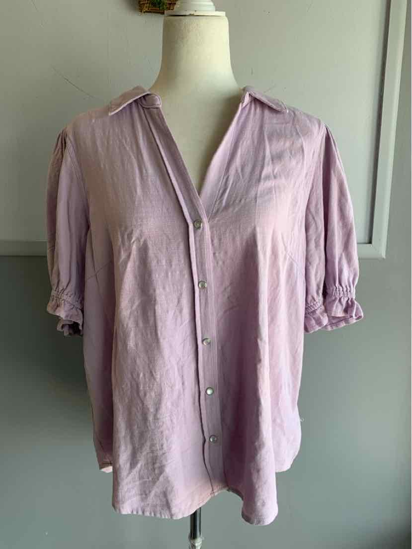 Light pink blouse with short puffed sleeves, V-neckline, and front button closure.