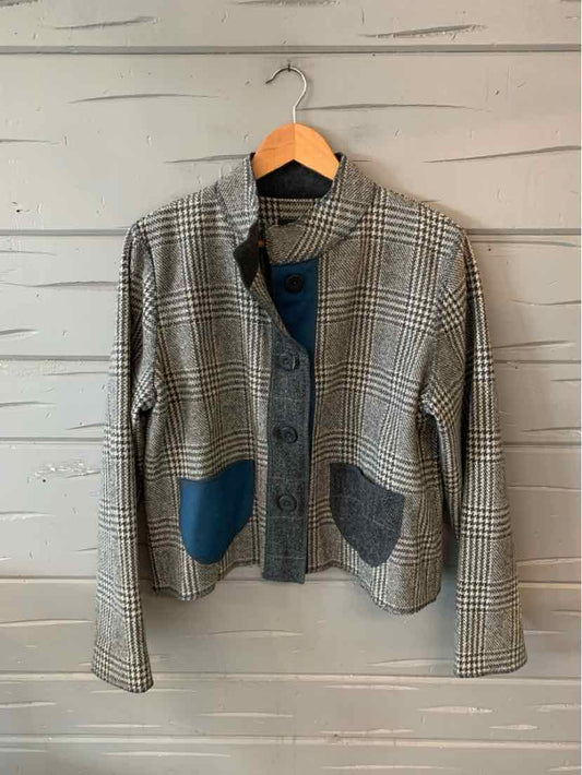 Gray plaid button-up jacket with navy and charcoal patch pockets and long sleeves.