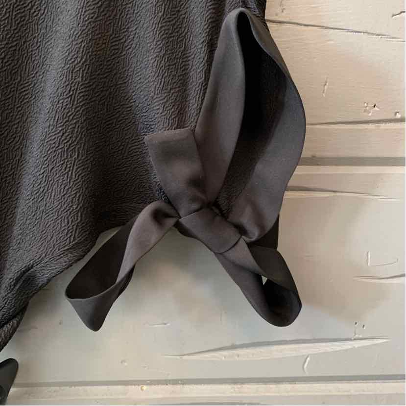 Black textured leather Halston Heritage tote with soft tied handles and a slouchy silhouette.